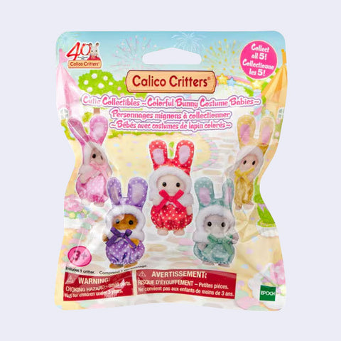 Front of a Calico Critters Colorful Bunny Costume Babies blind bag featuring five collectible baby figures in colorful bunny outfits, a 40th anniversary logo, and a Collect All 5 badge.