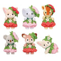 Six Calico Critters Very Berry Babies figures wearing red and pink strawberry-themed outfits with green leafy hats and white flower decorations, arranged in two rows against a white background.