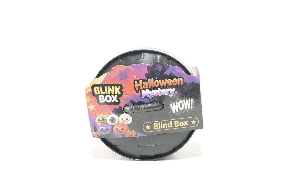 Round black Halloween mystery blind-box toy container with a colorful orange, purple, and black label reading "BLINK BOX," "Halloween Mystery," and "Blind Box," decorated with cartoon Halloween characters.