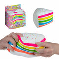 Product collage showing a rainbow cake-slice squishy, its Easy Sqweezy box and two hands squeezing the colorful layers.